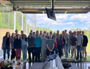 group photo of residents - 31 people standing together.